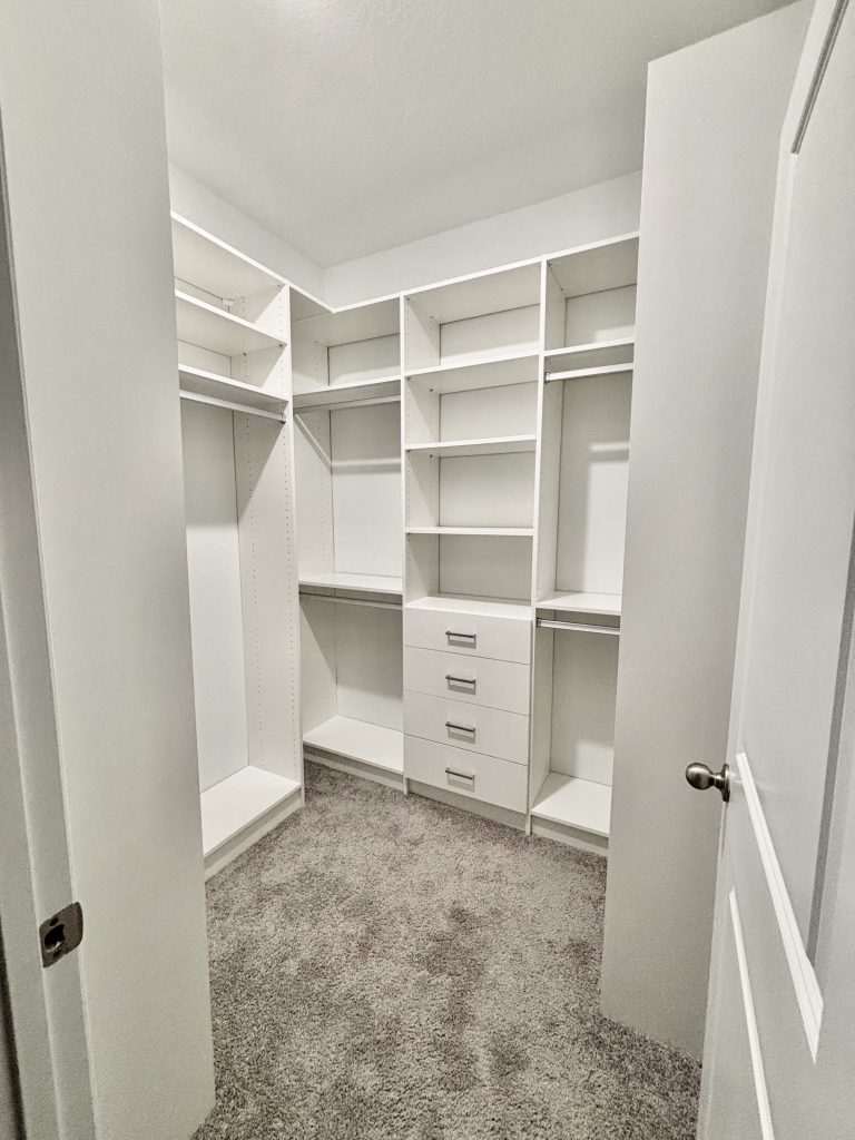 Custom walk-in closet with drawers, aluminum hardware in San Antonio Florida