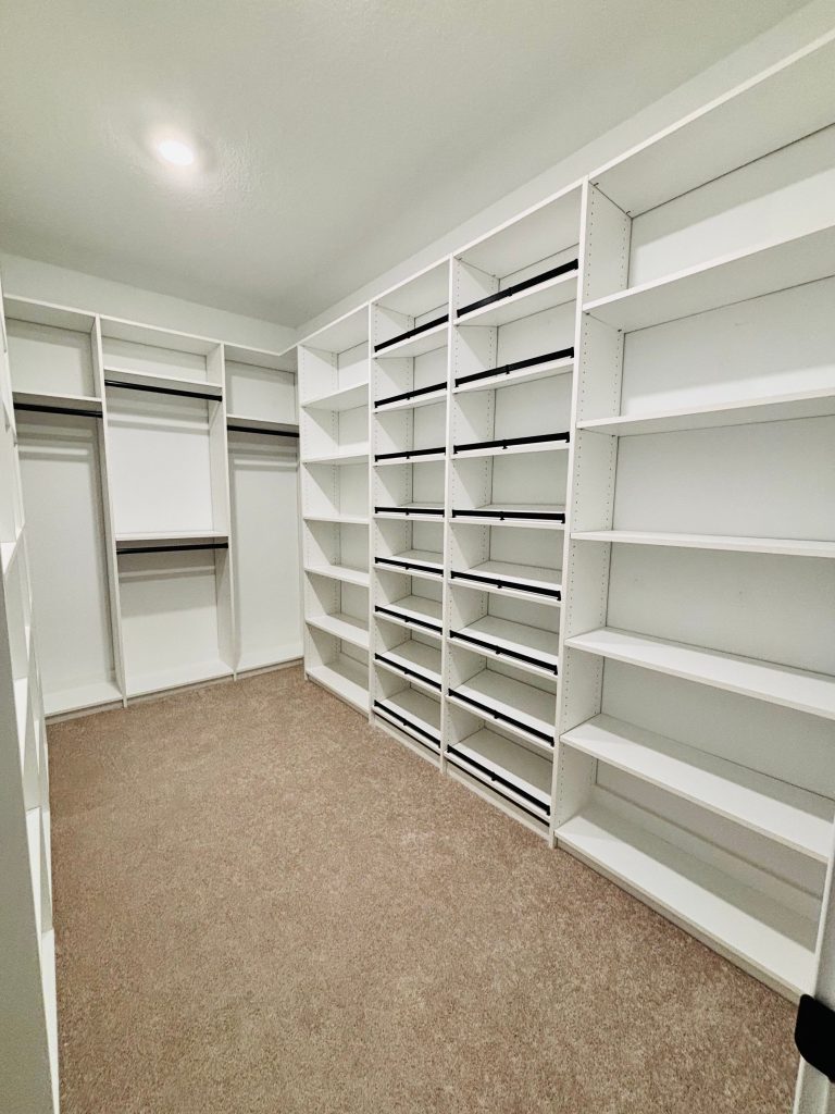Custom walk-in closet with shoe fence in Zephyrhills, Florida.