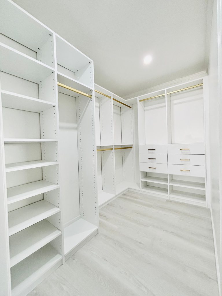 Custom walk-in closet with drawers in Spring Hill, Florida.