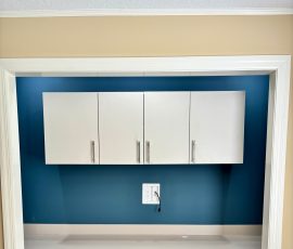 Custom office with doors, drawers, matte colors, chrome hardware in Dade City, Florida.