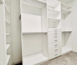 Custom walk-in closet with drawers, aluminum hardware in San Antonio, Florida.