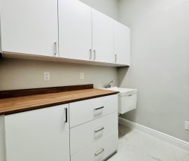 Custom laundry room project with doors, drawers, matte colors in Lithia, Florida. Custom laundry room with doors, drawers, matte colors in Lithia, Florida.