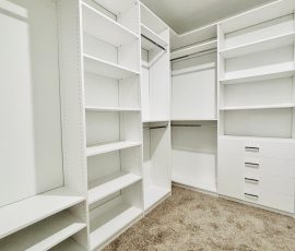 Custom walk-in closet with drawers, chrome hardware in Dade City, Florida.