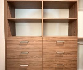 Custom walk-in closet with drawers, matte colors, aluminum hardware in San Antonio, Florida.
