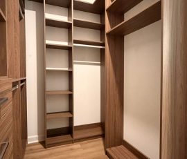 Custom walk-in closet with drawers, matte colors, aluminum hardware in San Antonio, Florida.