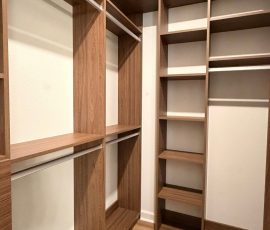 Custom walk-in closet with drawers, matte colors, aluminum hardware in San Antonio, Florida.