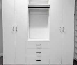 Custom walk-in closet project with doors, drawers, corner shelves, black hardware in Lithia, Florida. Custom walk-in closet with doors, drawers, corner shelves, black hardware in Lithia, Florida.
