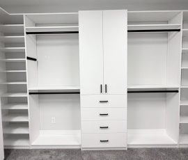 Custom walk-in closet project with doors, drawers, corner shelves, black hardware in Lithia, Florida. Custom walk-in closet with doors, drawers, corner shelves, black hardware in Lithia, Florida.