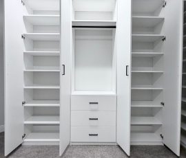 Custom walk-in closet project with doors, drawers, corner shelves, black hardware in Lithia, Florida. Custom walk-in closet with doors, drawers, corner shelves, black hardware in Lithia, Florida.