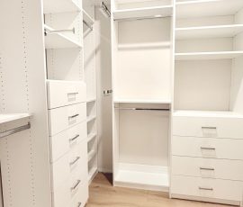 Custom walk-in closet with chrome hardware in San Antonio, Florida.