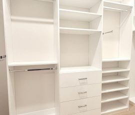Custom walk-in closet with chrome hardware in San Antonio, Florida.