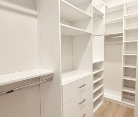 Custom walk-in closet with chrome hardware in San Antonio, Florida.