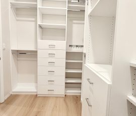 Custom walk-in closet with chrome hardware in San Antonio, Florida.