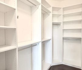 Custom walk-in closet with chrome hardware in Wesley Chapel, Florida.