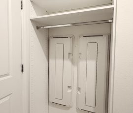 Custom walk-in closet with chrome hardware in San Antonio, Florida.